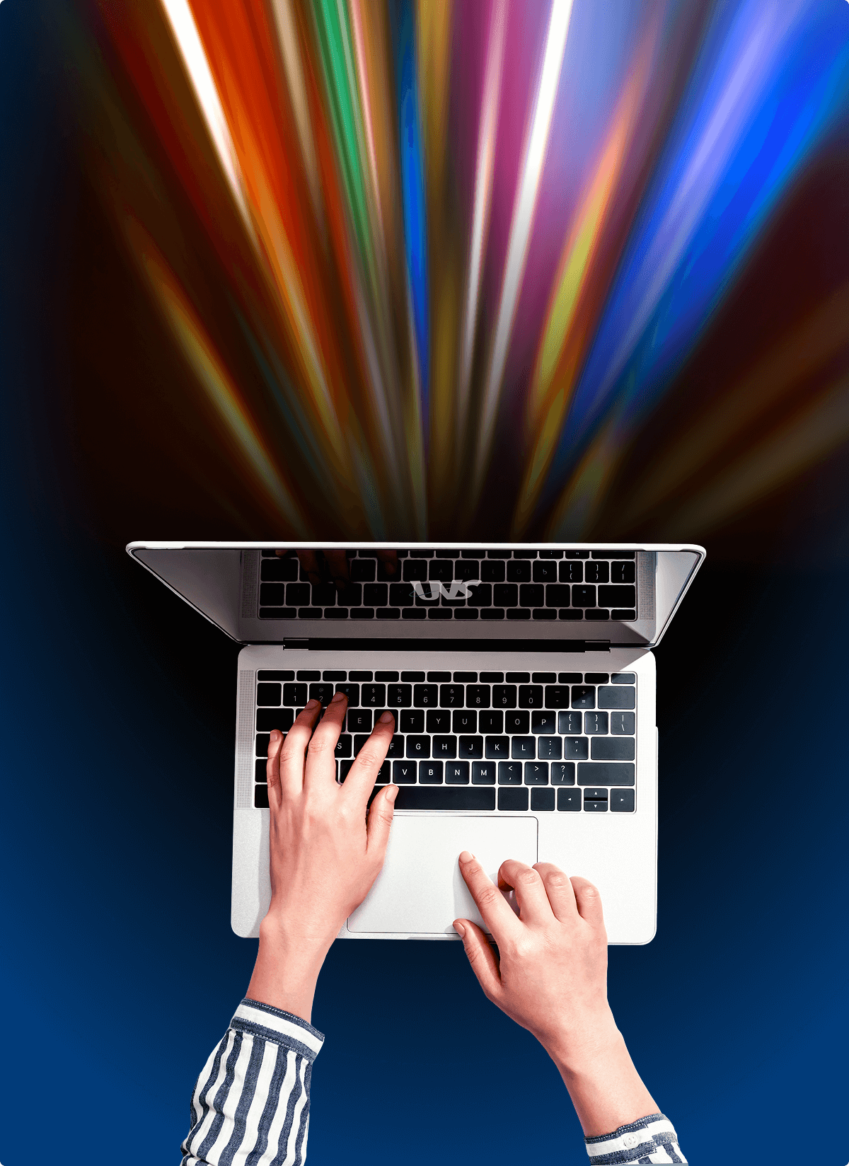 A pair of hands typing on a laptop with an array of rainbow-colored lights coming from the computer, symbolizing the fastest speeds with Usenet that are available through UsenetServer.