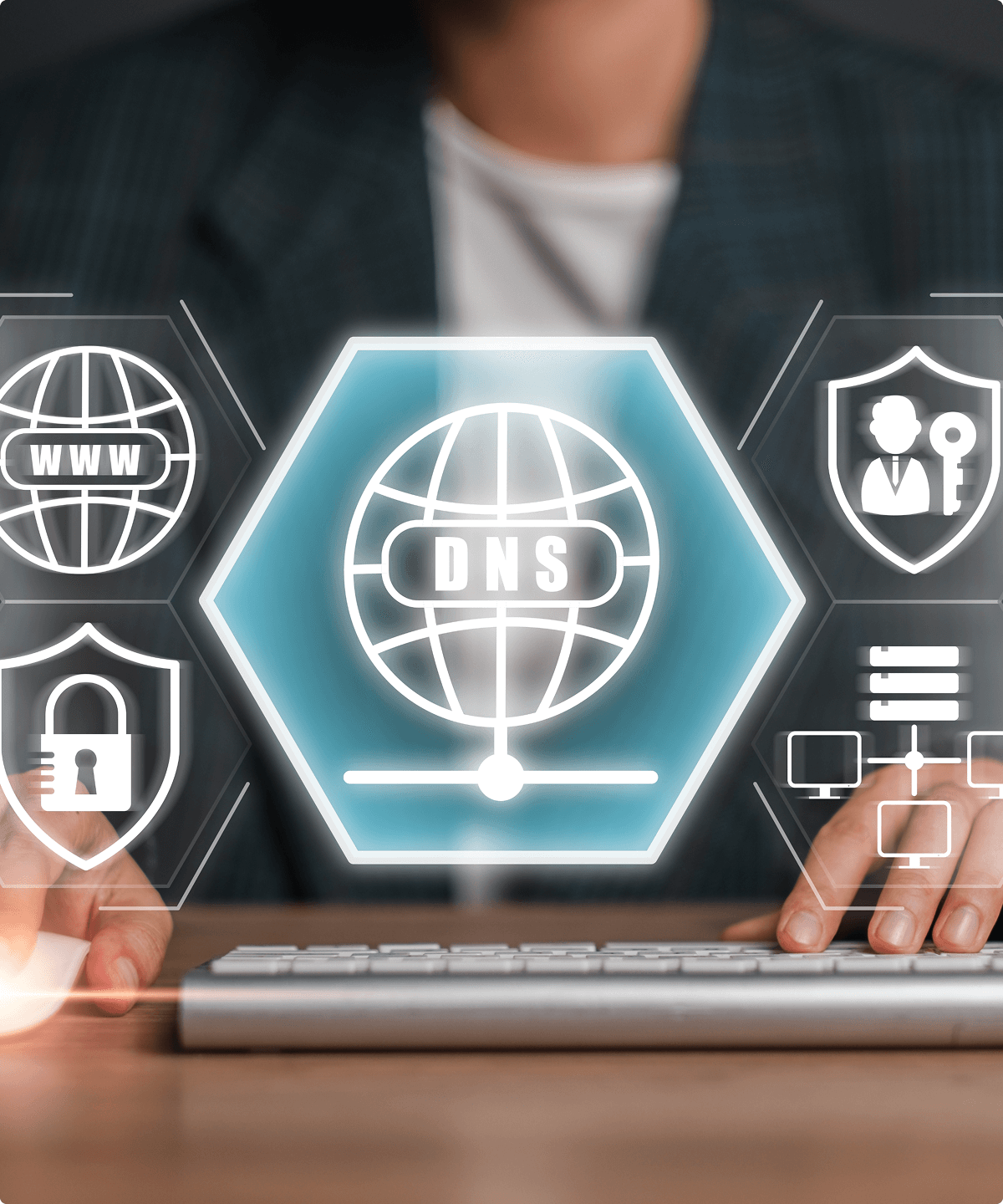A person sits at a computer keyboard in front of floating symbols that represent different capabilities of UsenetServer’s DNS servers.