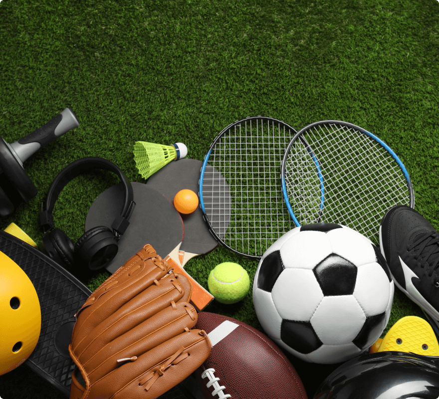 Assorted sports equipment including soccer ball, tennis rackets, and baseball glove symbolizing the 'rec' Usenet newsgroup for recreation and sports.