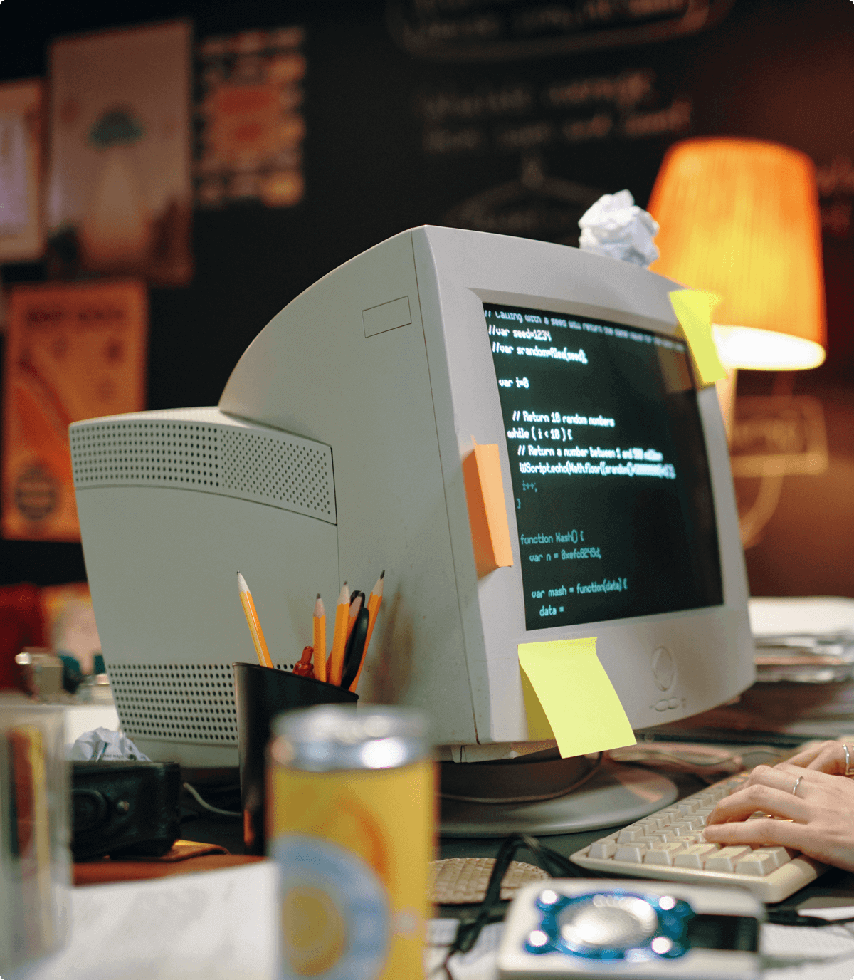 A desk in somebody’s room with a computer using an old CRT monitor and MS-DOS on the screen.