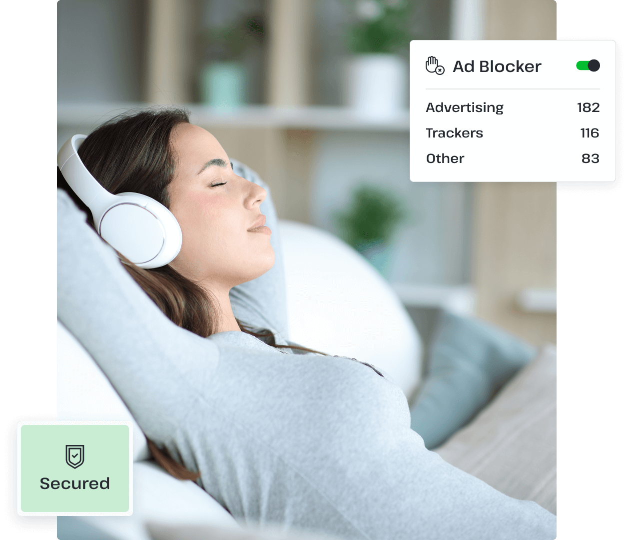A woman relaxes on a sofa wearing a pair of headphones, with a pop-up beside her showing that her device is secure against ads and advertisement trackers.