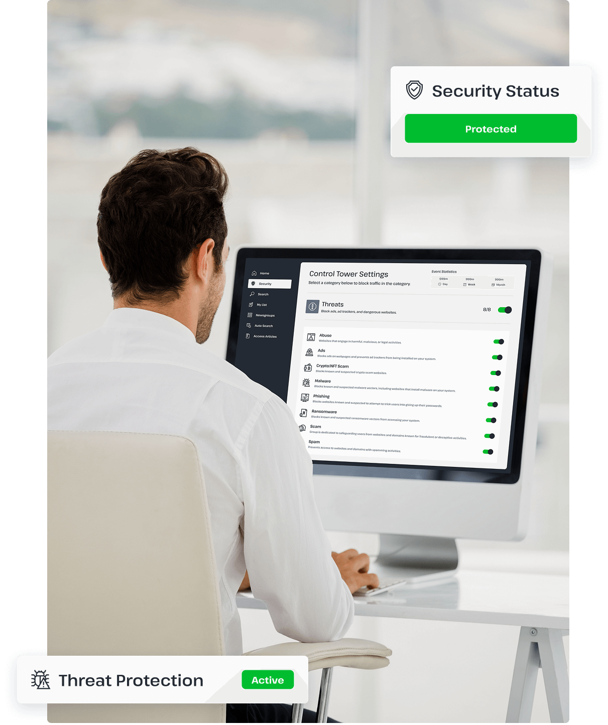 A man is using a desktop computer connected to UsenetServer’s premium VPN, showing that he is using the threat protection tool to protect his online browsing.