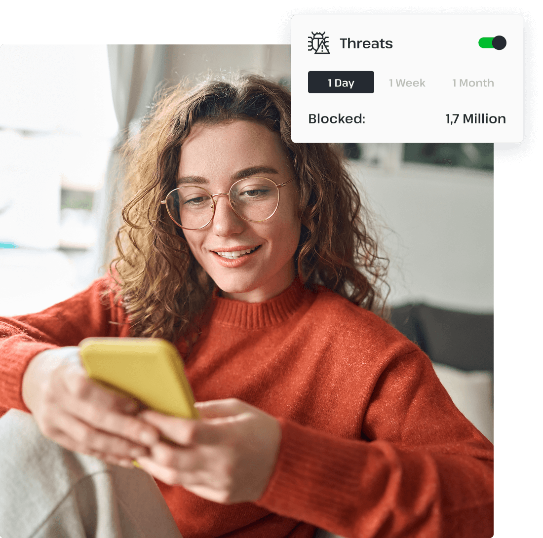 A woman in glasses uses UsenetServer’s VPN on her mobile phone to protect herself against threats on her smartphone.
