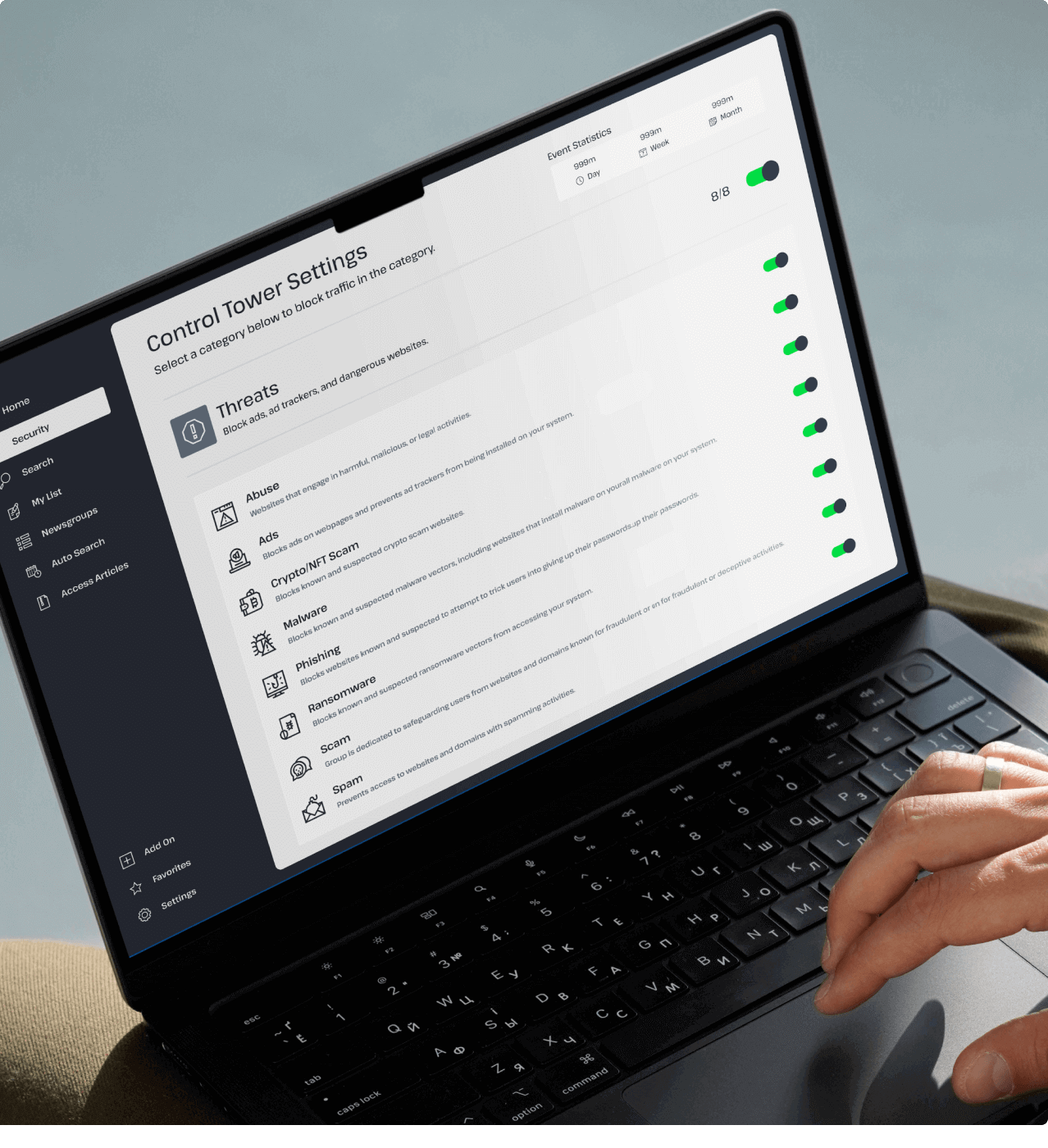 A person is looking at a laptop. It says “Control Tower Settings” and shows several of the ways that the included VPN’s “Control Tower” feature can protect your privacy, block ads, and prevent malware from infecting your system.