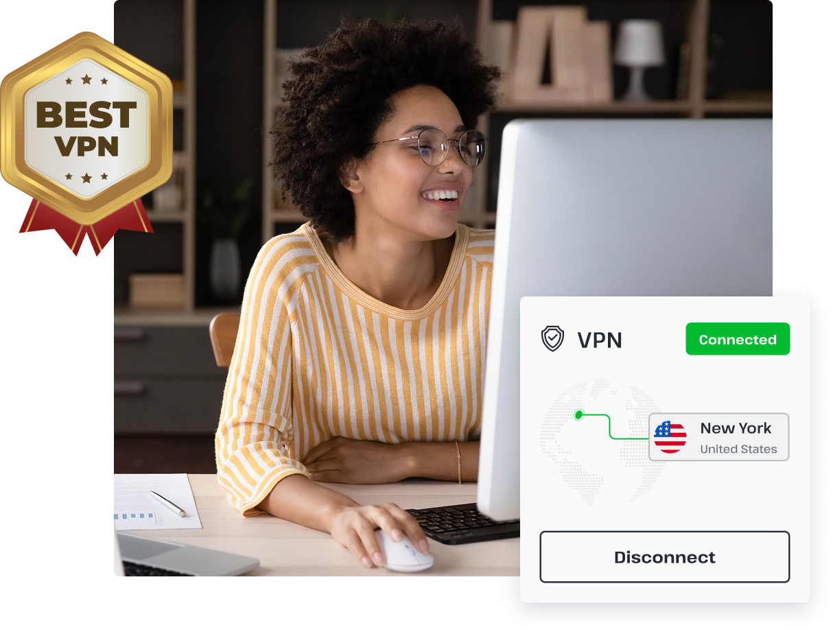 A woman smiles while browsing on her desktop computer, thanks to the security of the UsenetServer VPN for Usenet.